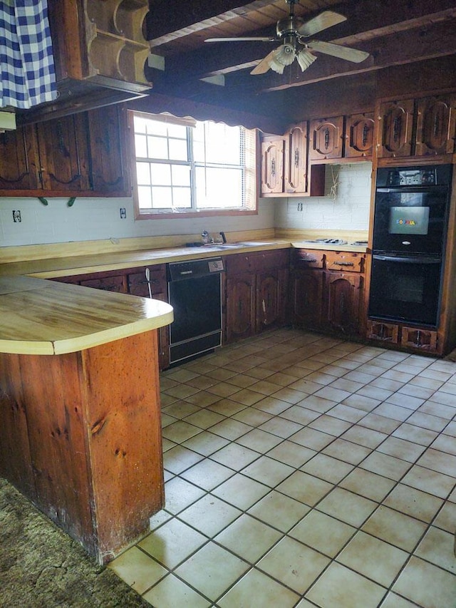 kitchen featuring black appliances, ceiling fan, light tile patterned flooring, and dark brown cabinetry