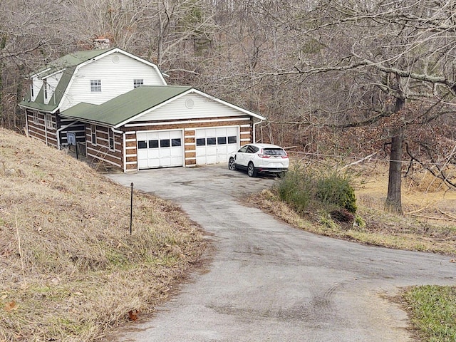 view of property exterior with a garage