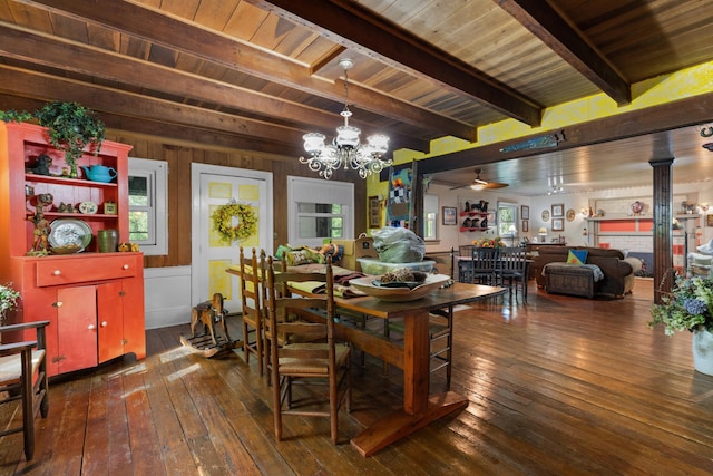 dining area with beamed ceiling, ceiling fan with notable chandelier, wooden ceiling, and dark wood-type flooring