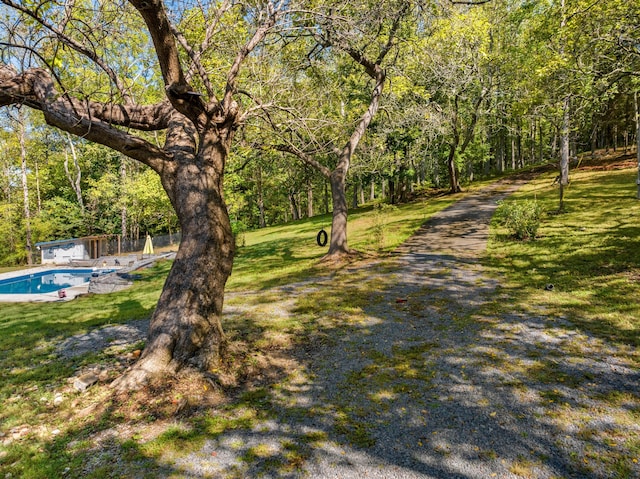 view of property's community featuring a yard