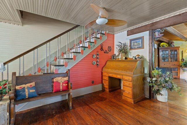 staircase with ceiling fan and wood-type flooring