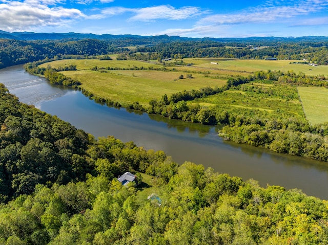 birds eye view of property with a water and mountain view