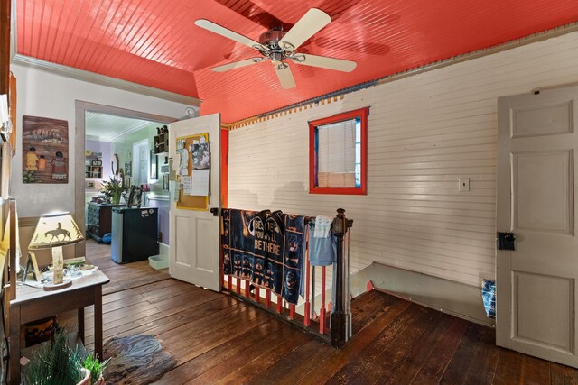 interior space featuring hardwood / wood-style flooring, ceiling fan, and ornamental molding