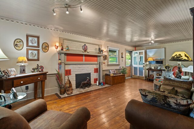 living room featuring a fireplace and hardwood / wood-style floors