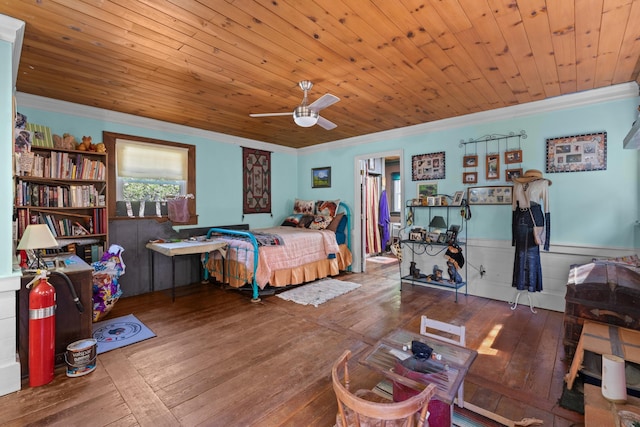 bedroom featuring hardwood / wood-style flooring, ceiling fan, wood ceiling, and crown molding