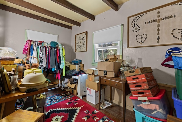 misc room with beam ceiling and dark hardwood / wood-style flooring