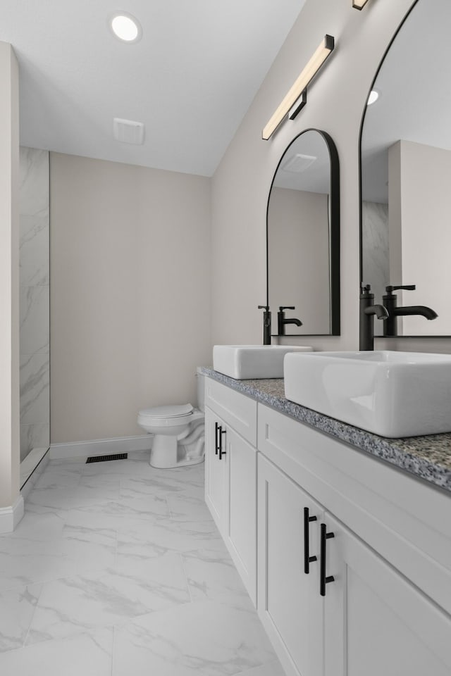 3083 Bridgewater Blvd, Morristown, TN 37814 - full bath with marble look tiles, double vanity, a marble finish shower, and recessed lighting