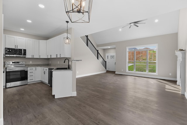 3083 Bridgewater Blvd, Morristown, TN 37814 - kitchen featuring stainless steel appliances, open floor plan, recessed lighting, dark wood-style floors, and white cabinetry