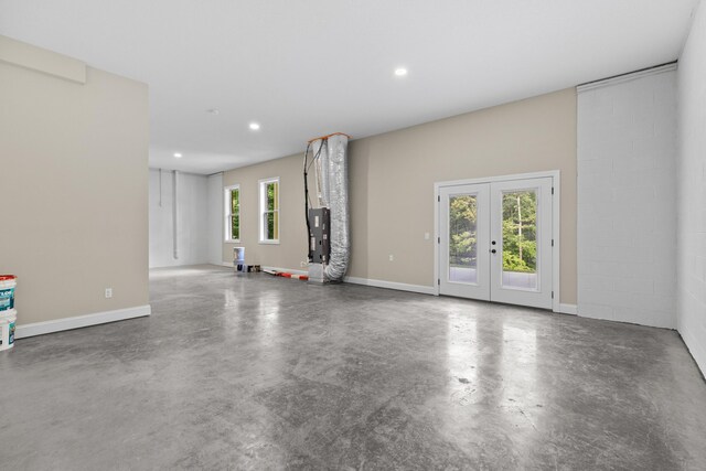 3083 Bridgewater Blvd, Morristown, TN 37814 - unfurnished living room featuring concrete flooring, french doors, and recessed lighting