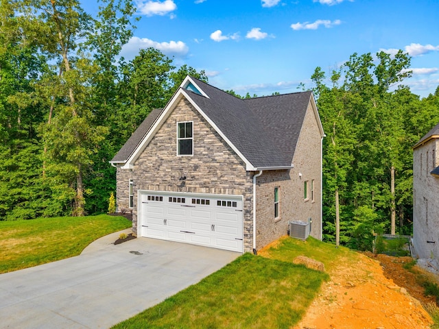 3083 Bridgewater Blvd, Morristown, TN 37814 - view of home's exterior featuring stone siding, a lawn, driveway, and roof with shingles