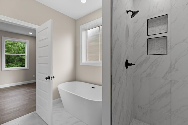 3083 Bridgewater Blvd, Morristown, TN 37814 - bathroom with a soaking tub, tiled shower, recessed lighting, and marble look tile flooring