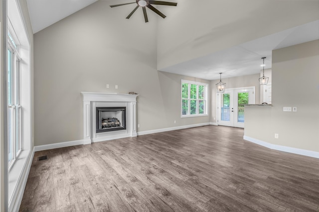 3083 Bridgewater Blvd, Morristown, TN 37814 - unfurnished living room with ceiling fan, dark wood-type flooring, a fireplace, and a towering ceiling