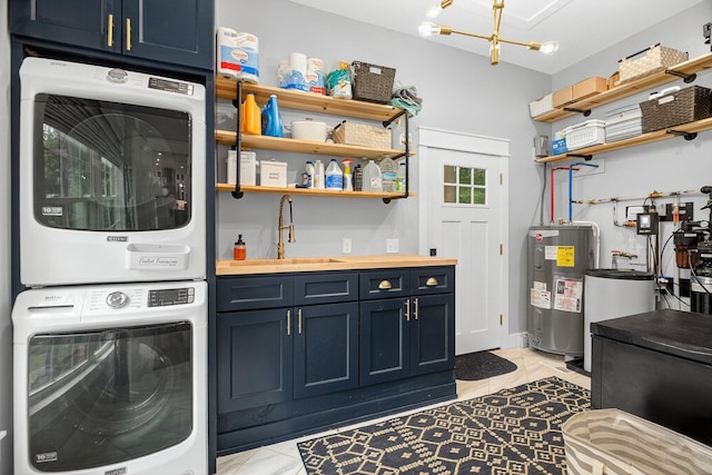 718 Mullins Dr, Sneedville, TN 37869 - washroom featuring stacked washer / drying machine, cabinet space, electric water heater, and a chandelier