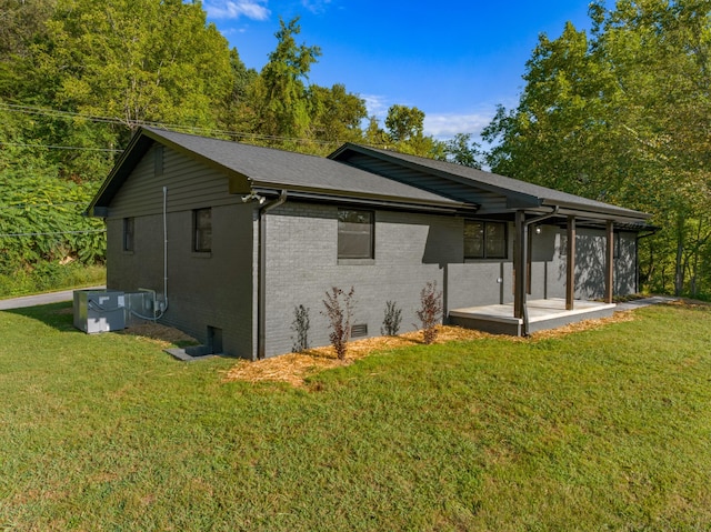 view of side of home featuring a yard