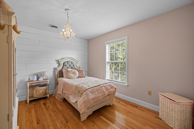 1790 Butterfly Ct, Whitesburg, TN 37891 - bedroom featuring a chandelier, light wood finished floors, and baseboards