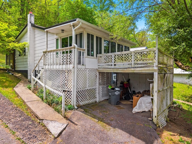 1900 Mountain View Ave, Kingsport, TN 37664 - rear view of house featuring a wooden deck, stairs, a sunroom, and a chimney