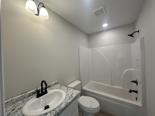 full bathroom featuring vanity,  shower combination, and toilet