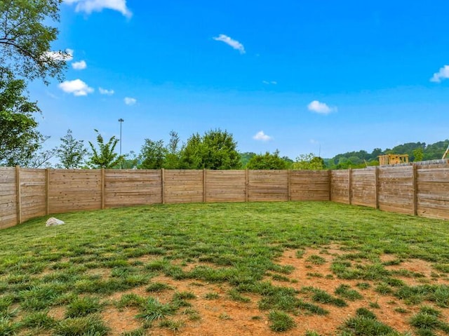 view of yard featuring a fenced backyard