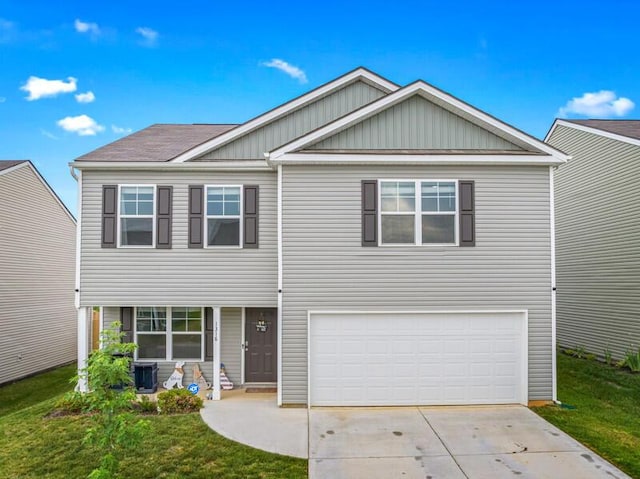 view of front of property with a garage, board and batten siding, central AC, and driveway