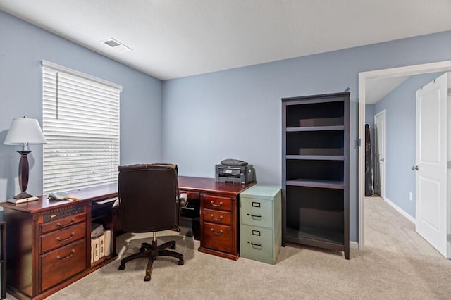office with visible vents and light carpet