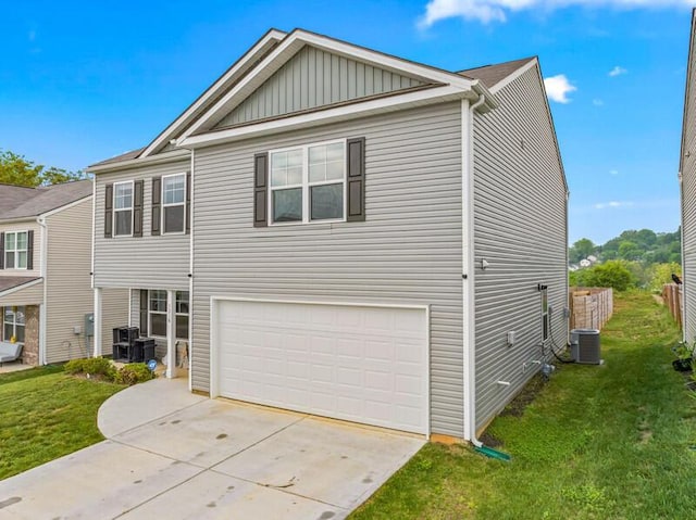 view of front of home with board and batten siding, a front yard, a garage, fence, and concrete driveway