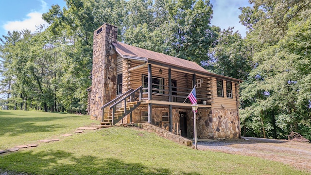 484 Buttermilk Rd, Blountville, TN 37617 - view of front of home featuring stone siding, log siding, a front lawn, a chimney, and stairs