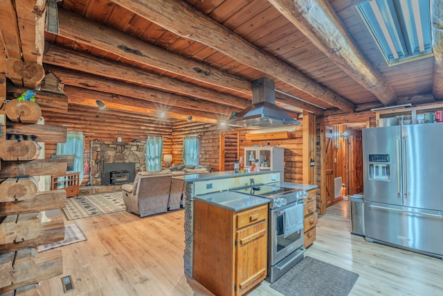 484 Buttermilk Rd, Blountville, TN 37617 - kitchen with appliances with stainless steel finishes, island exhaust hood, rustic walls, light wood finished floors, and a wooden ceiling with exposed beams
