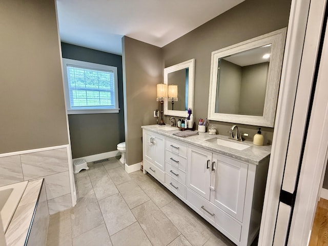 2466 Kidwell Ridge Rd, Morristown, TN 37814 - bathroom featuring toilet, baseboards, and double vanity