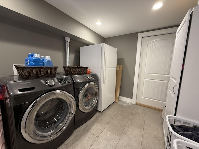 2466 Kidwell Ridge Rd, Morristown, TN 37814 - laundry room with washing machine and dryer, recessed lighting, light tile patterned flooring, and baseboards