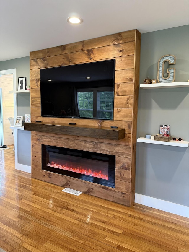 2466 Kidwell Ridge Rd, Morristown, TN 37814 - detailed view of a fireplace, wood finished floors, baseboards, and recessed lighting