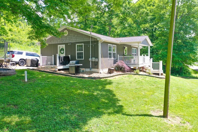 2466 Kidwell Ridge Rd, Morristown, TN 37814 - view of front of home featuring a porch, a front yard, and board and batten siding
