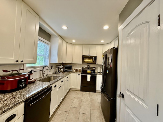 2466 Kidwell Ridge Rd, Morristown, TN 37814 - kitchen featuring black appliances, a sink, dark stone countertops, white cabinetry, and recessed lighting