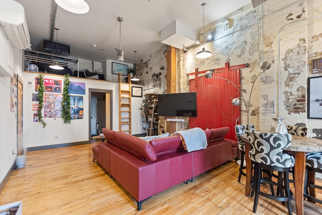 living area featuring a high ceiling and wood finished floors