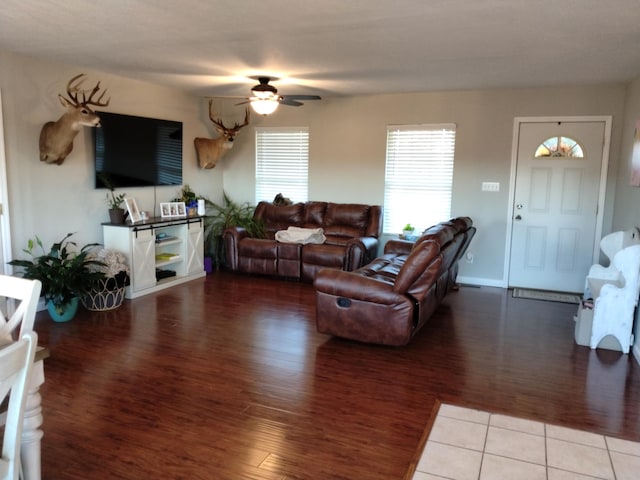 living room with hardwood / wood-style flooring and ceiling fan