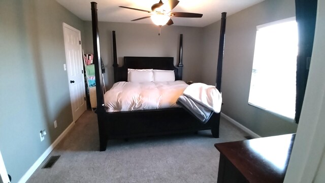 bedroom featuring ceiling fan and light colored carpet