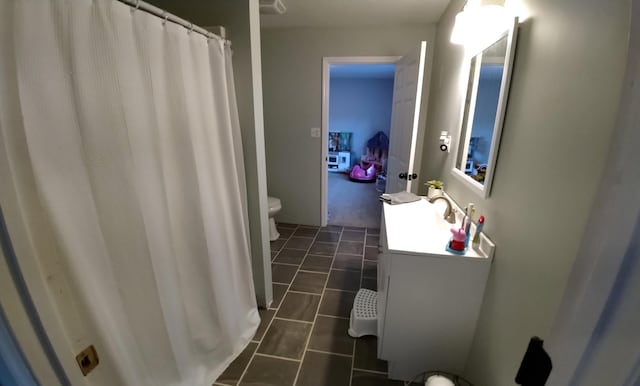 bathroom with vanity and toilet