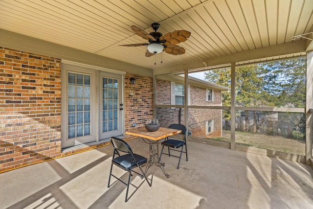 sunroom / solarium featuring ceiling fan