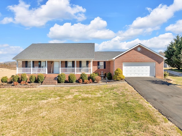 ranch-style house with aphalt driveway, brick siding, a porch, a front yard, and a garage