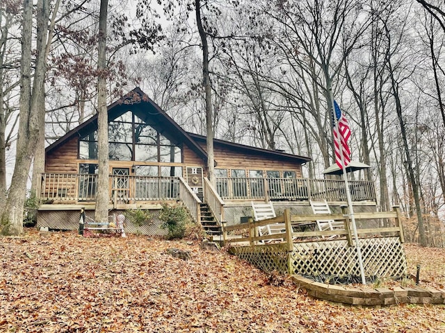 back of property featuring a deck