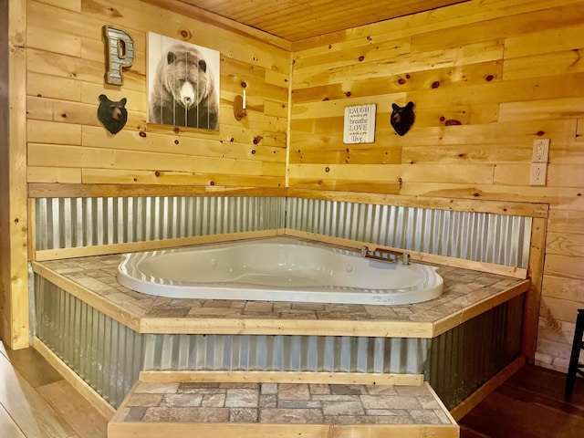 bathroom with wood walls and wood ceiling