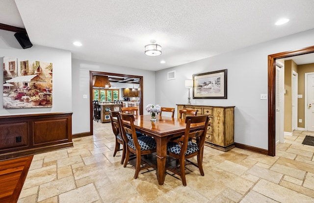 1442 Darbee Dr, Morristown, TN 37814 - dining space with stone tile flooring, recessed lighting, and a textured ceiling