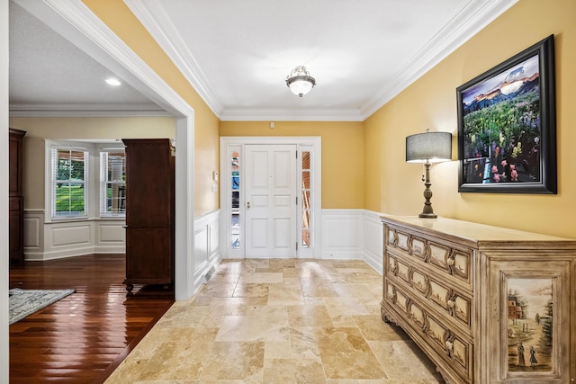 1442 Darbee Dr, Morristown, TN 37814 - foyer entrance with a decorative wall, crown molding, wainscoting, and light stone finish floors