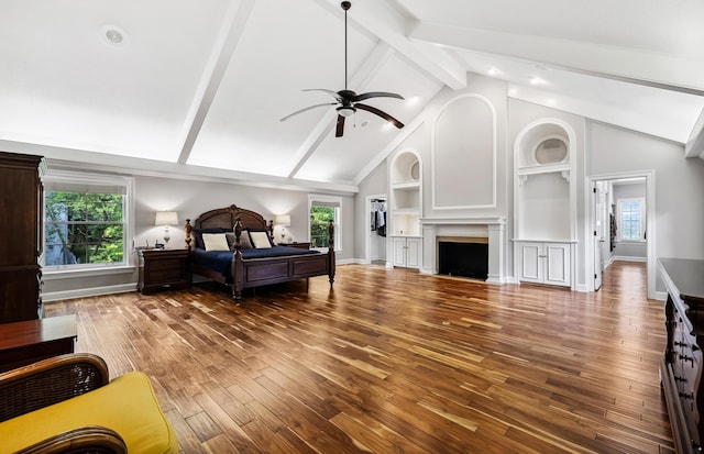 1442 Darbee Dr, Morristown, TN 37814 - bedroom featuring wood finished floors, multiple windows, a fireplace, and a ceiling fan