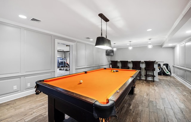 1442 Darbee Dr, Morristown, TN 37814 - game room featuring a decorative wall, crown molding, billiards table, wood finished floors, and bar