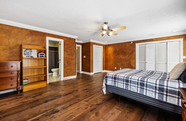 1442 Darbee Dr, Morristown, TN 37814 - bedroom featuring dark wood-type flooring, a textured ceiling, ornamental molding, ceiling fan, and multiple closets