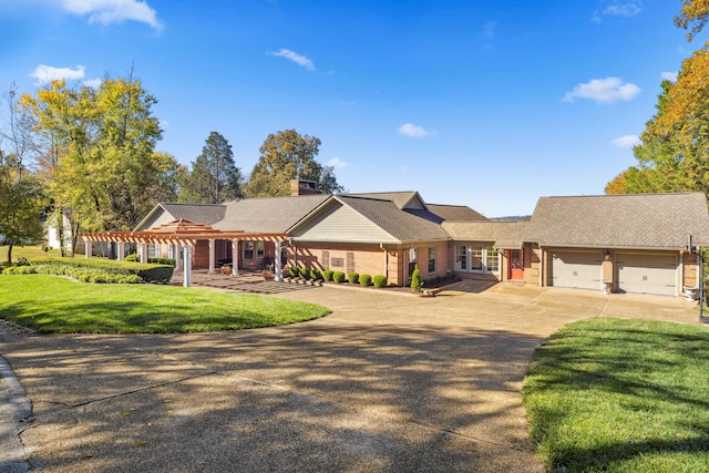 1442 Darbee Dr, Morristown, TN 37814 - single story home with concrete driveway, a front lawn, a chimney, a garage, and brick siding