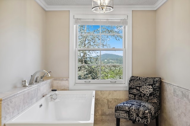1442 Darbee Dr, Morristown, TN 37814 - bathroom with a bathtub, tile walls, a wainscoted wall, a chandelier, and ornamental molding