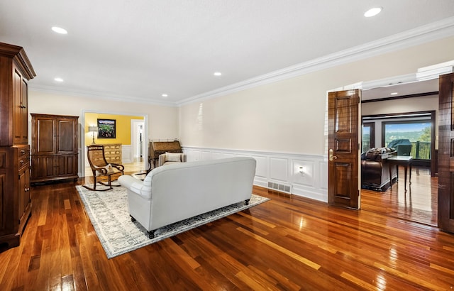 1442 Darbee Dr, Morristown, TN 37814 - living area with dark wood-type flooring, ornamental molding, a wainscoted wall, recessed lighting, and a decorative wall