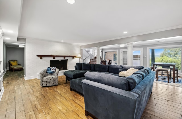 1442 Darbee Dr, Morristown, TN 37814 - living area with decorative columns, crown molding, light wood-style floors, stairway, and recessed lighting