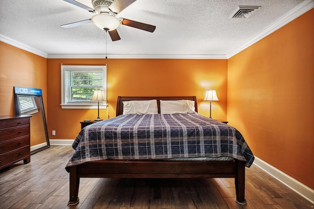 1442 Darbee Dr, Morristown, TN 37814 - bedroom with a textured ceiling, wood finished floors, a ceiling fan, and ornamental molding